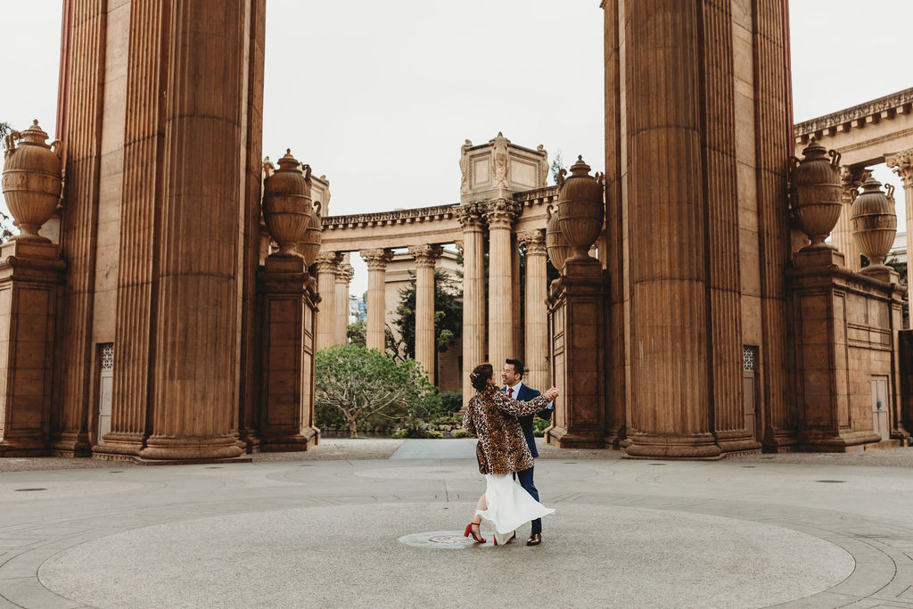 newly eloped couple dancing at the palace of fine arts in san francisco