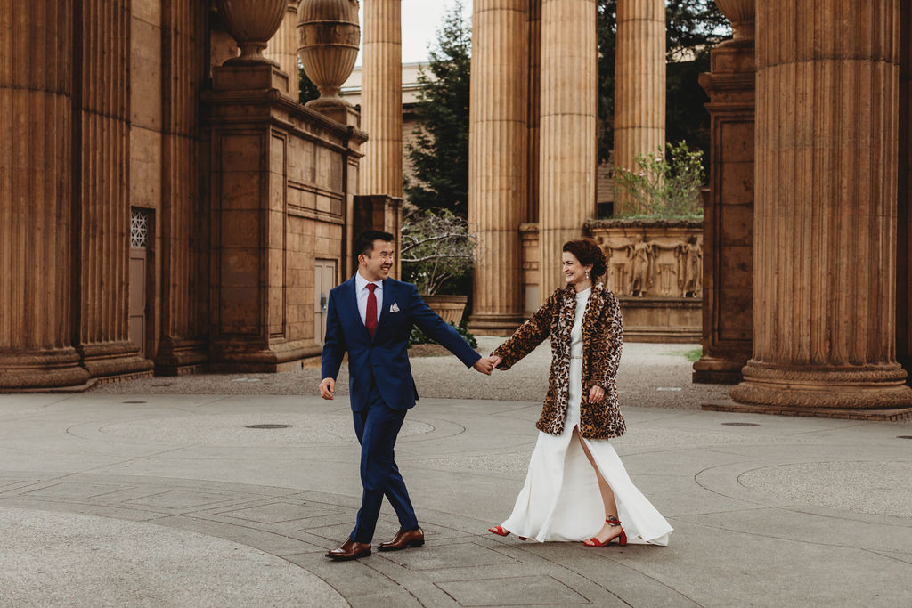 couple walking holding hands during their elopement