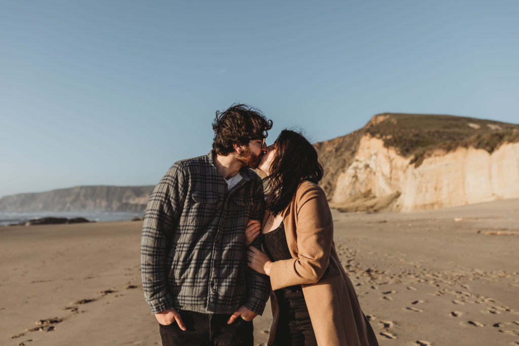 couple kissing at beach