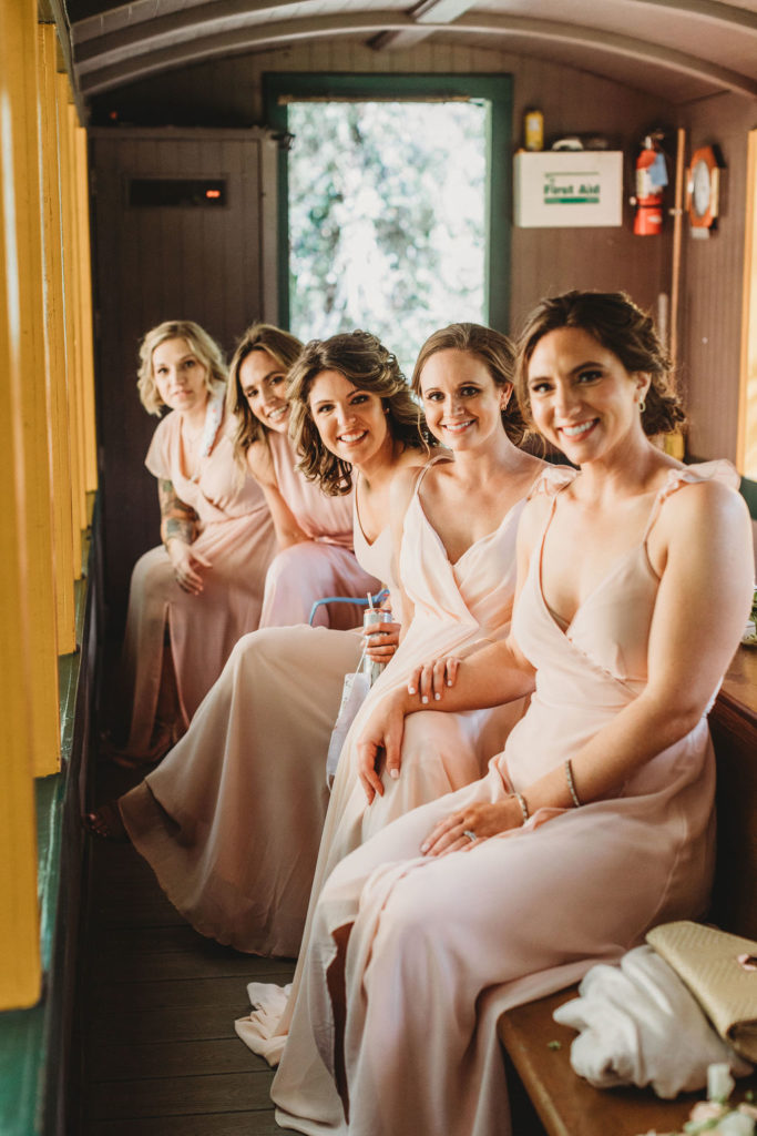 wedding train in the forest with bridesmaids