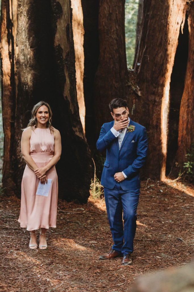 groom reaction at forest wedding