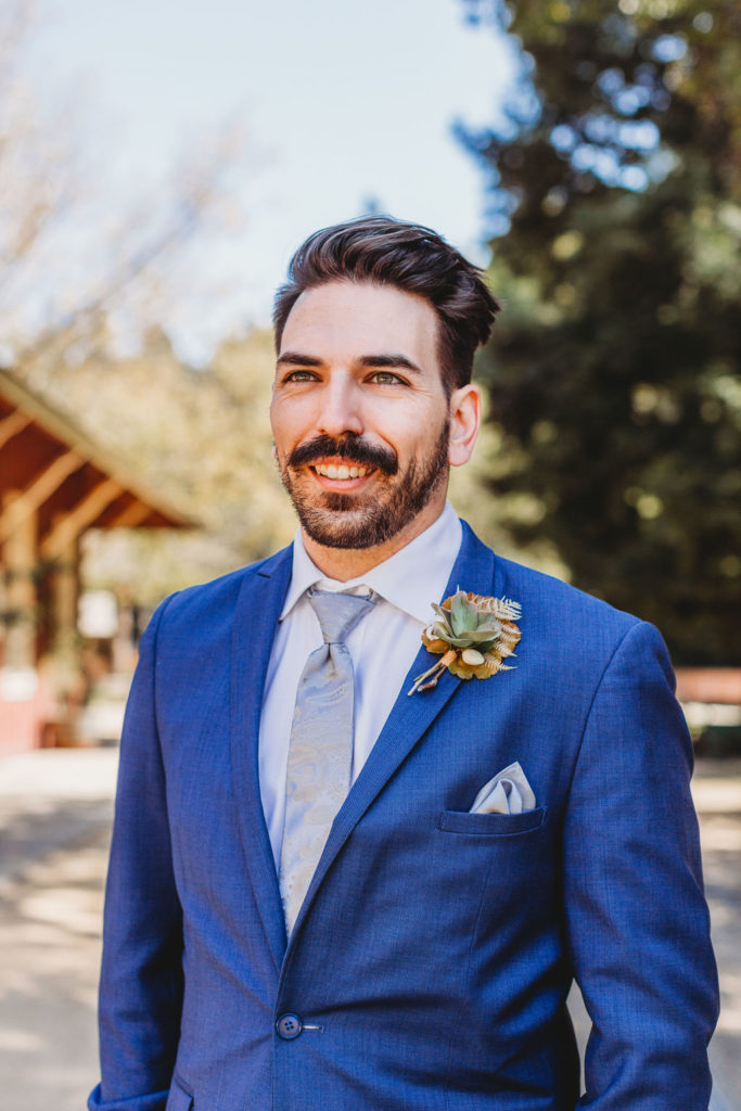 photo of groom in his blue wedding suit