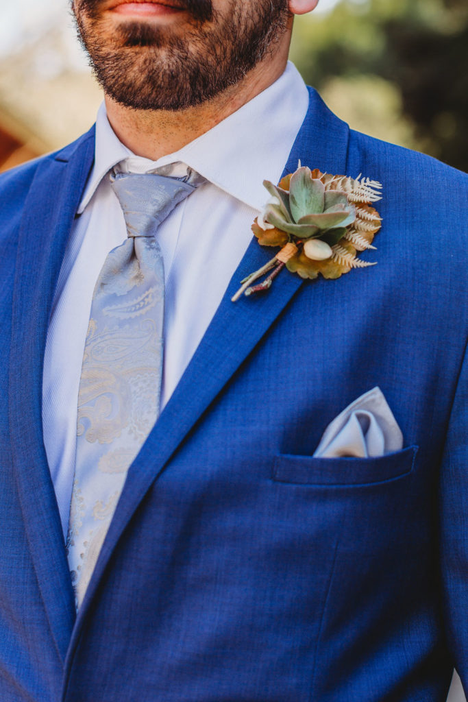 photo of groom in his blue wedding suit