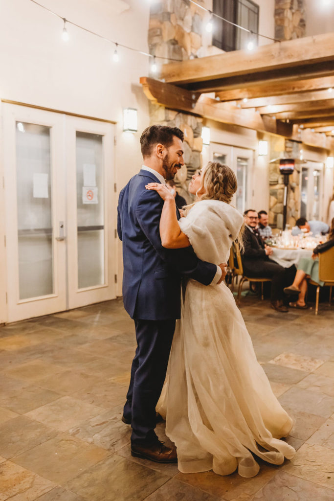bride and groom dancing their first dance at forest wedding