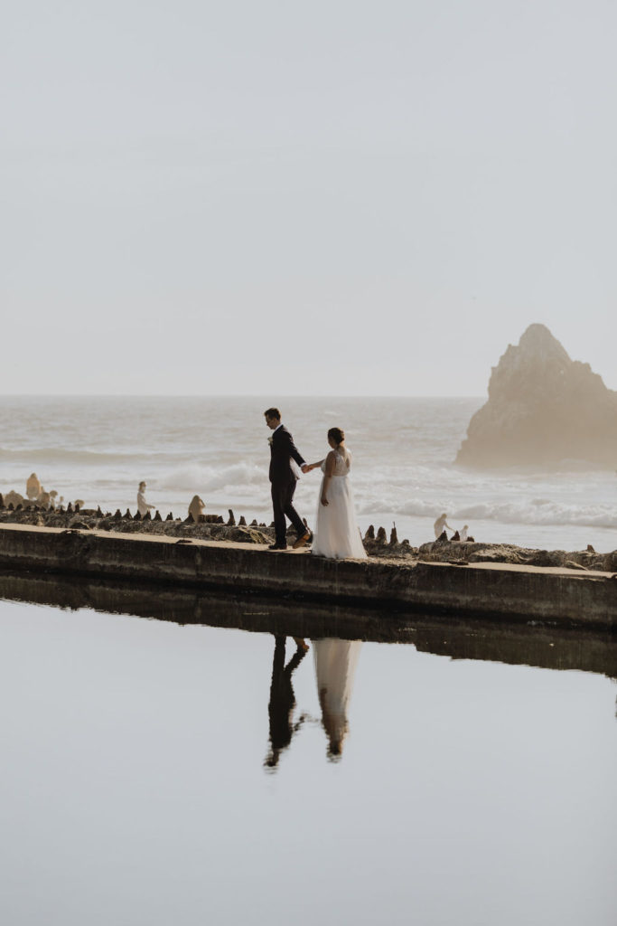 couple elope on cliffside of ocean