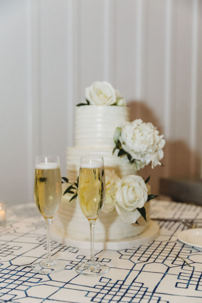 white wedding cake with white flowers