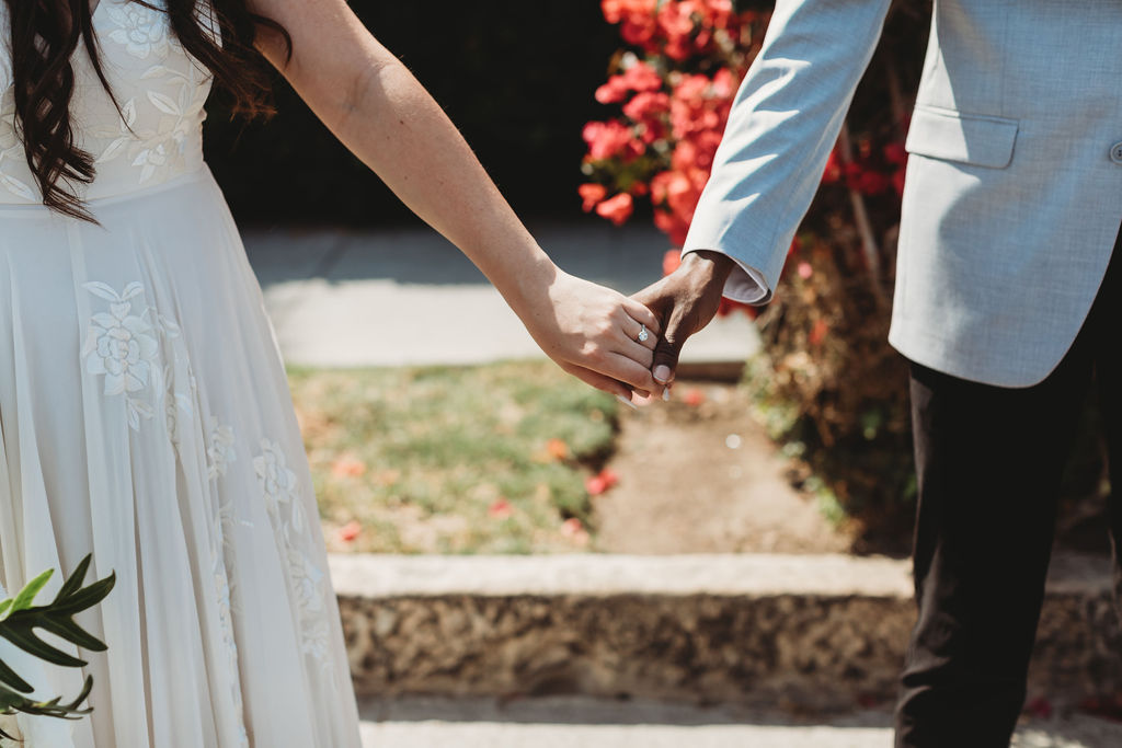 couple holding hands at elopement