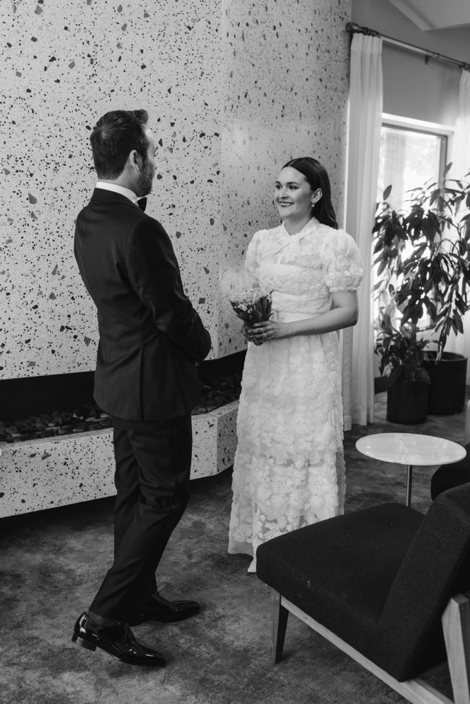 Groom seeing bride for the first time before wedding