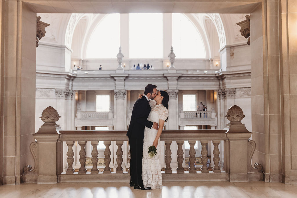 Couple kissing after San Fracisco City Hall wedding
