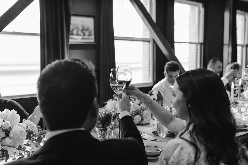 bride and groom toasting during wedding dinner at wayfare tavern in san francisco ca