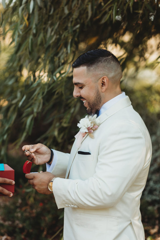 Groom opening gift from bride