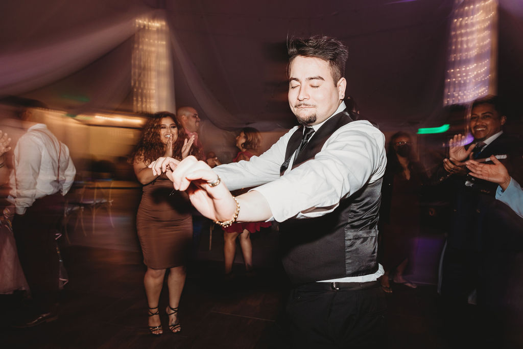 wedding guests dancing during wedding reception