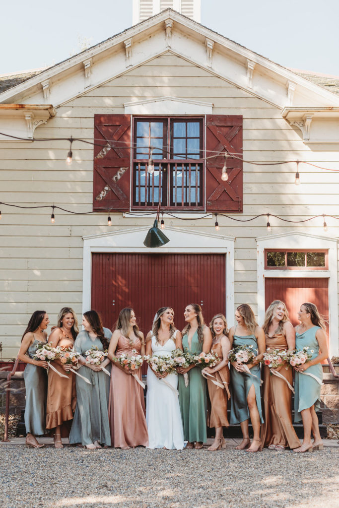 bride and bridesmaids posing for wedding photos