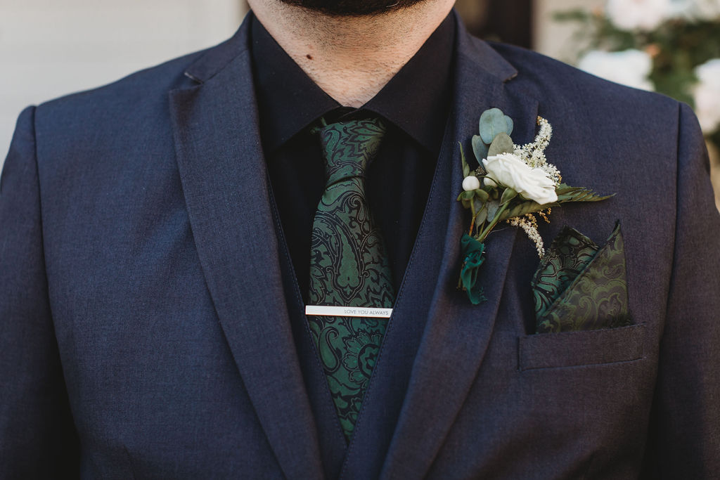 Groom wearing his boutonniere