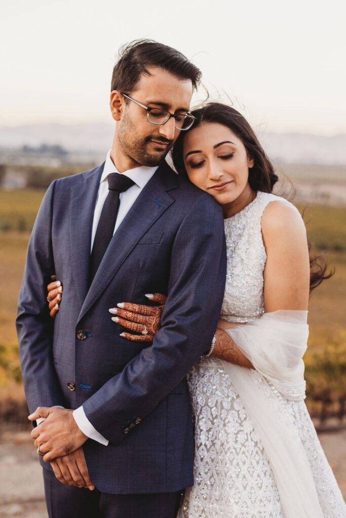 Indian wedding couple embracing at a wedding venue in Sonoma, CA