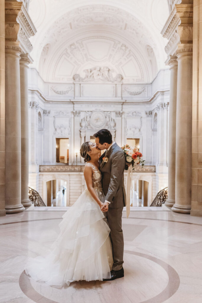 Couple kissing after eloping at San Francisco City Hall
